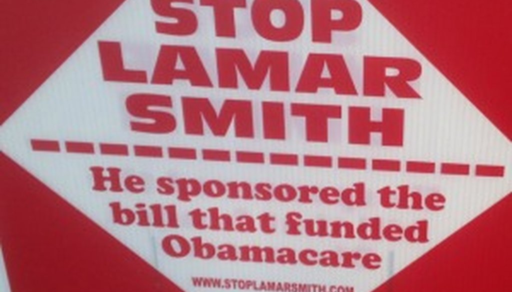 We spotted this sign making an Obamacare claim about Lamar Smith outside an Austin polling place Feb. 23, 2014.