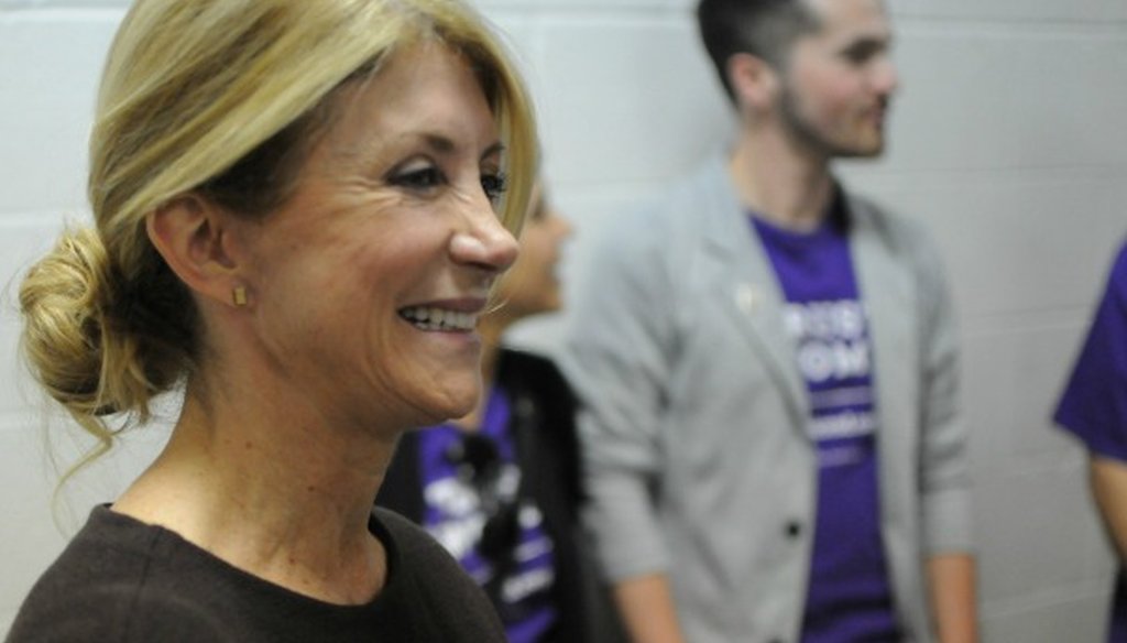Wendy Davis, shown stumping in South Dakota for Hillary Clinton in May 2016, earlier made an incorrect claim about Texas not having an 'equal pay' law (Photo by the Associated Press).