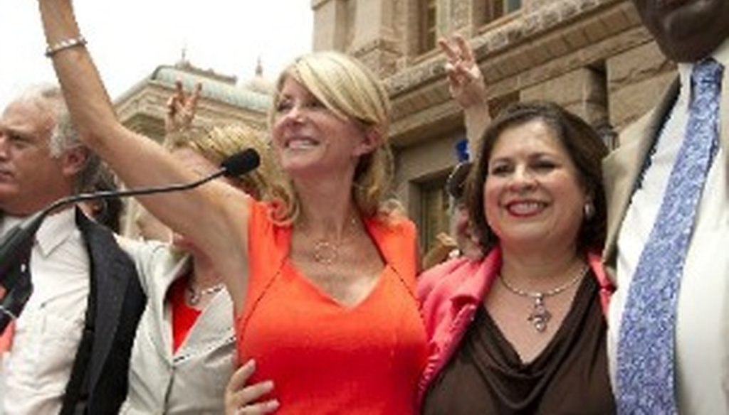 State Sen. Wendy Davis, flanked by fellow Democratic senators outside the Texas Capitol on July 1, 2013 (Austin American-Statesman, Jay Janner).