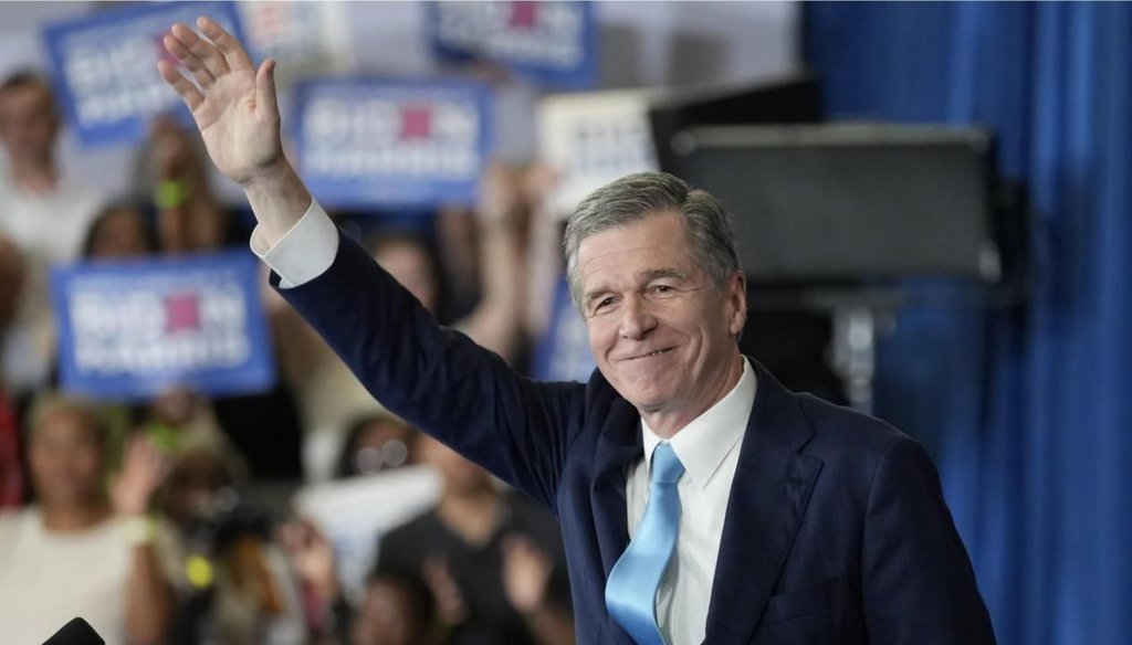 N.C.Gov. Roy Cooper waves to the crowd at a Biden-Harris campaign event in Greensboro during the 2020 presidential campaign. (AP Photo/Chuck Burton)