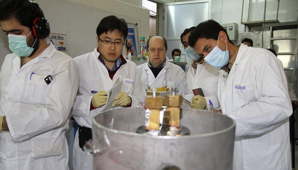 International Atomic Energy Agency inspectors and Iranian technicians monitor the Natanz facility in Iran on Jan. 20, 2014. (AP Photo)