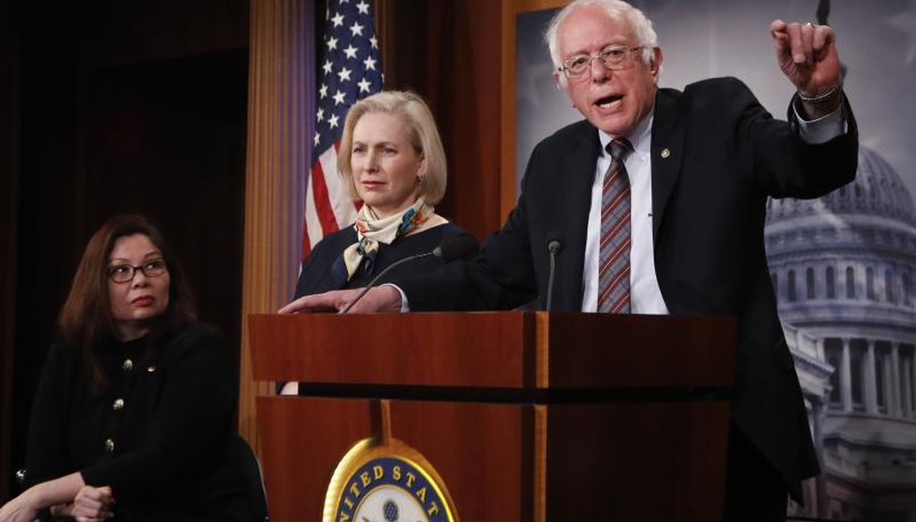 Sen. Bernie Sanders, I-Vt., right, with Sen. Tammy Duckworth, D-Ill., left, and Kirsten Gillibrand, D-N.Y., speaks to reporters during a news conference about the Family Act, Tuesday, March 14, 2017, on Capitol Hill in Washington. (AP Photo/Manuel Balce)