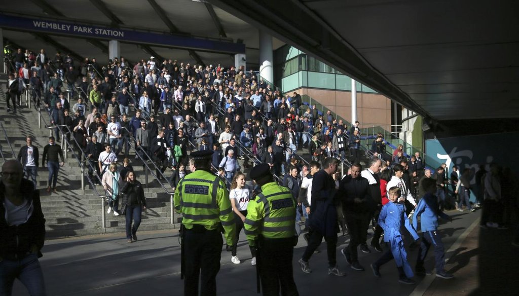 Police observe the crowds outside Wembley Park Station ahead of a soccer match, following a terrorist attack Friday on a train at Parsons Green Station, in London, on Sept. 16, 2017. (AP)