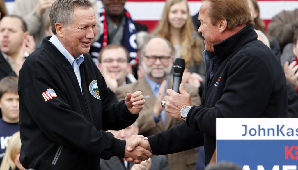 Arnold Schwarzenegger endorses Ohio Gov. John Kasich for president at a rally in Columbus. Jay LaPrete / AP