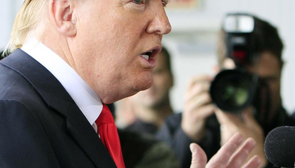 Donald Trump talks to reporters after arriving at the Pease International Tradeport Wednesday, April 27, 2011 in Portsmouth, N.H. (AP/Jim Cole)