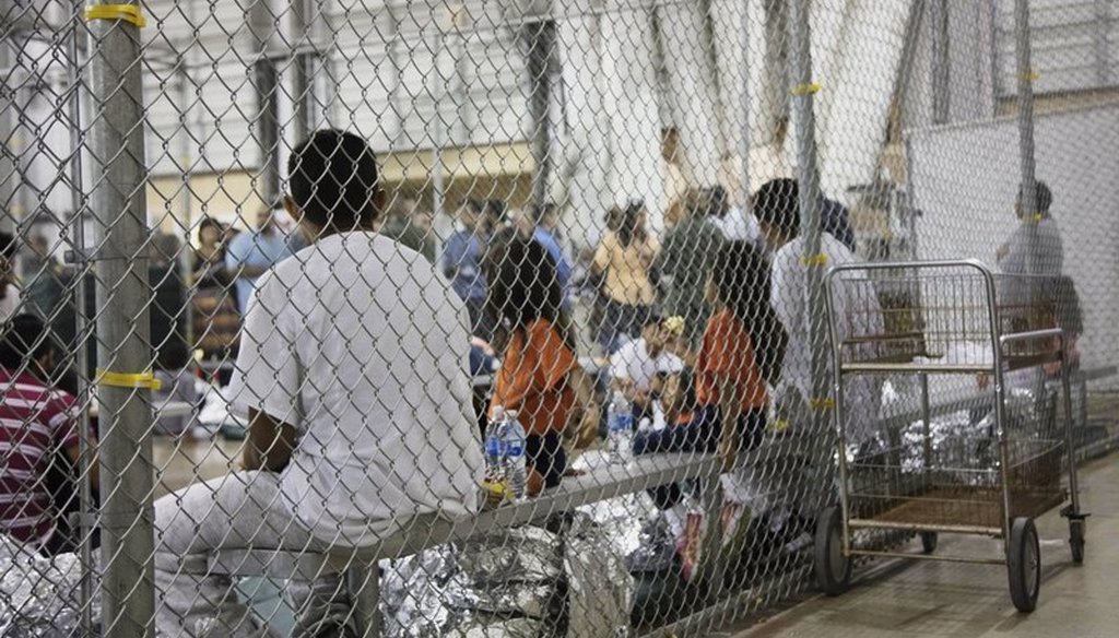 In this photo provided by U.S. Customs and Border Protection, people who’ve been taken into custody related to cases of illegal entry into the United States, sit in one of the cages at a facility in McAllen, Texas, June 17, 2018. (via AP)