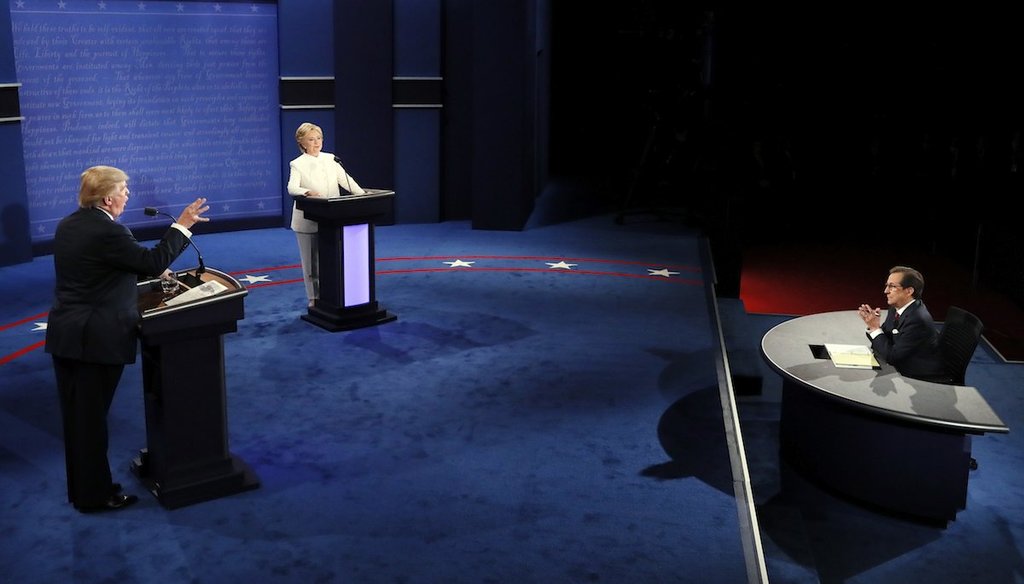 Moderator Chris Wallace questions Democratic presidential nominee Hillary Clinton and Republican presidential nominee Donald Trump during the third presidential debate at UNLV in Las Vegas, Wednesday, Oct. 19, 2016. (Mark Ralston/Pool via AP)