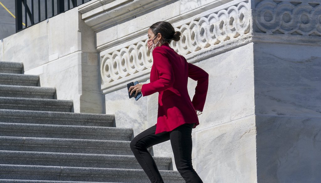 Rep. Alexandria Ocasio-Cortez, D-N.Y., sprints up the steps of the House of Representatives as she rushes to a vote, at the Capitol in Washington, Wednesday, March 3, 2021. (AP)