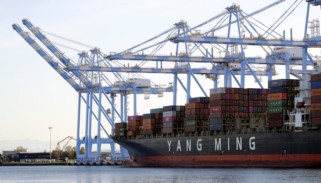 Cargo cranes remove containers from a Yang Ming Marine Transport Corp. boat at the Port of Tacoma in Tacoma, Wash. in 2019. (AP)