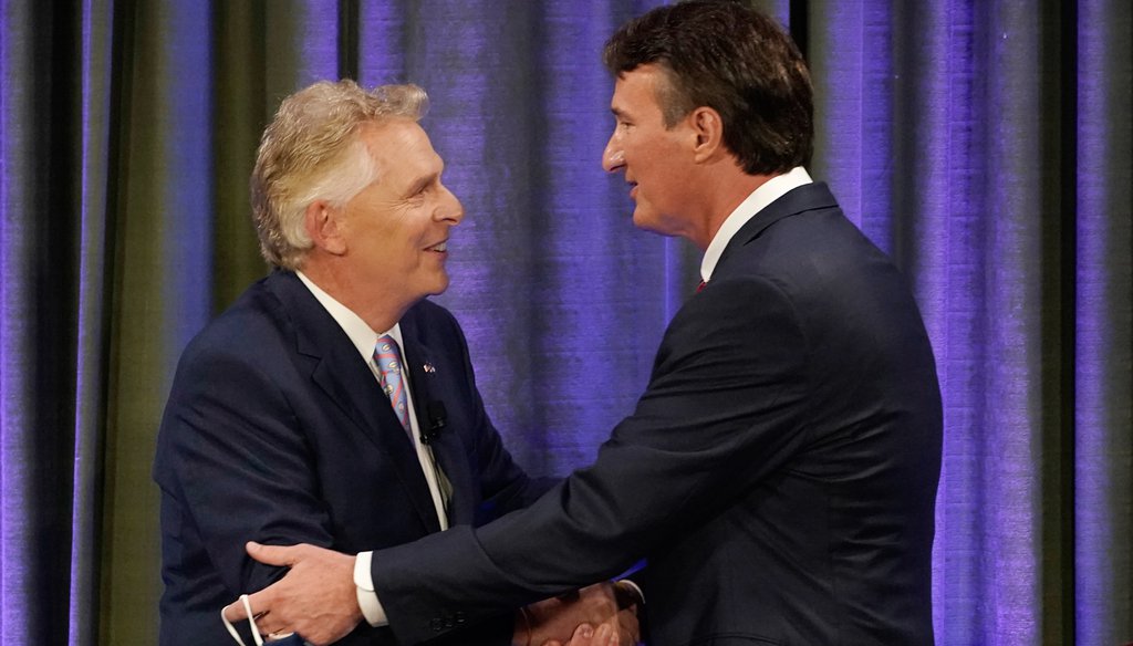 Democratic gubernatorial candidate former Governor Terry McAuliffe, left, greets Republican challenger, Glenn Youngkin, at the start of a debate at the Appalachian School of Law in Grundy, Va., Thursday, Sept. 16, 2021. (AP Photo/Steve Helber)