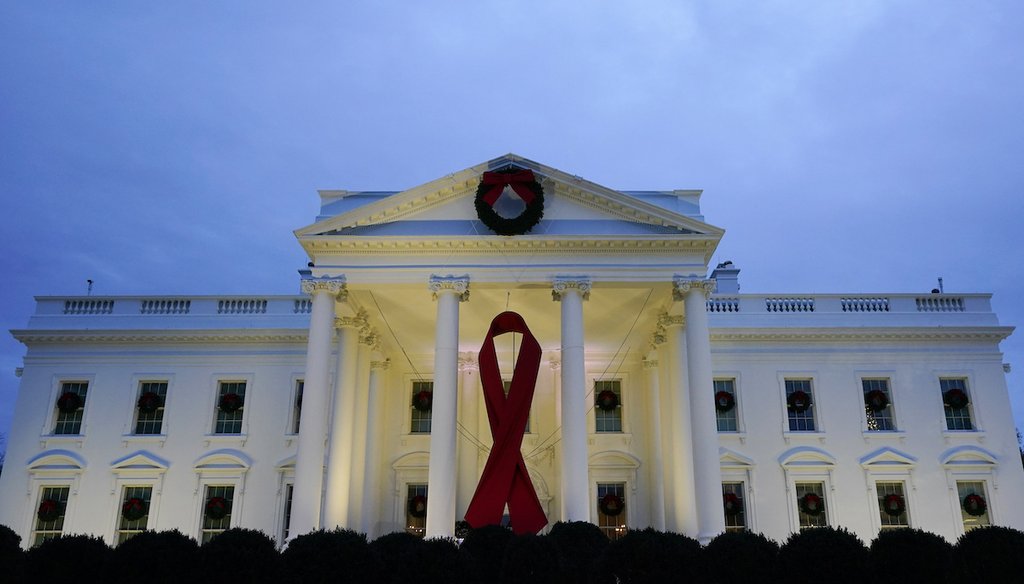 The White House in Washington is decorated to commemorate World AIDS Day, Wednesday, Dec. 1, 2021. (AP)