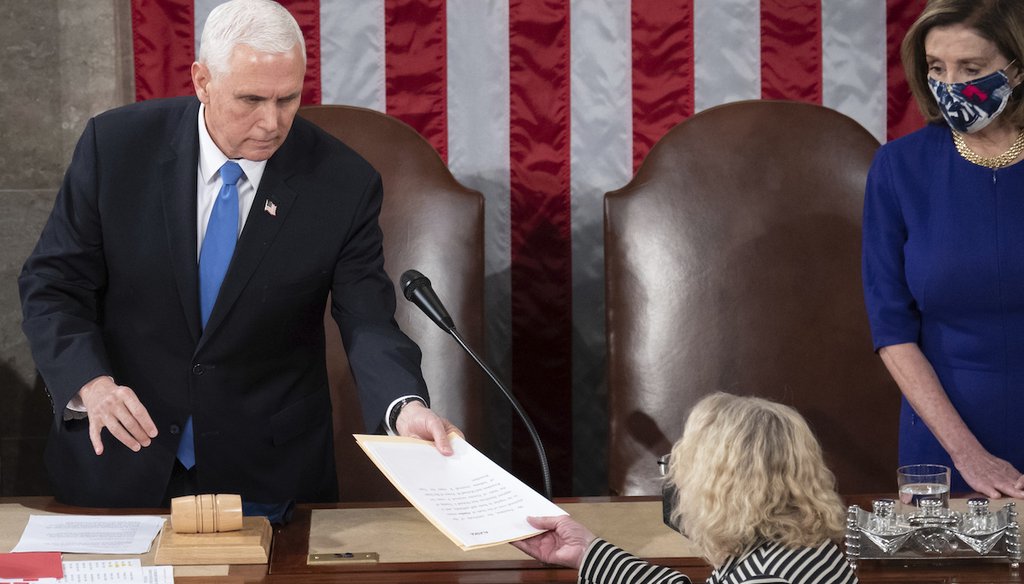Vice President Mike Pence hands the electoral certificate from Arizona to Rep. Zoe Lofgren, D-Calif., as he presides over a joint session of Congress to count the Electoral College votes on Jan. 6, 2021. (AP)