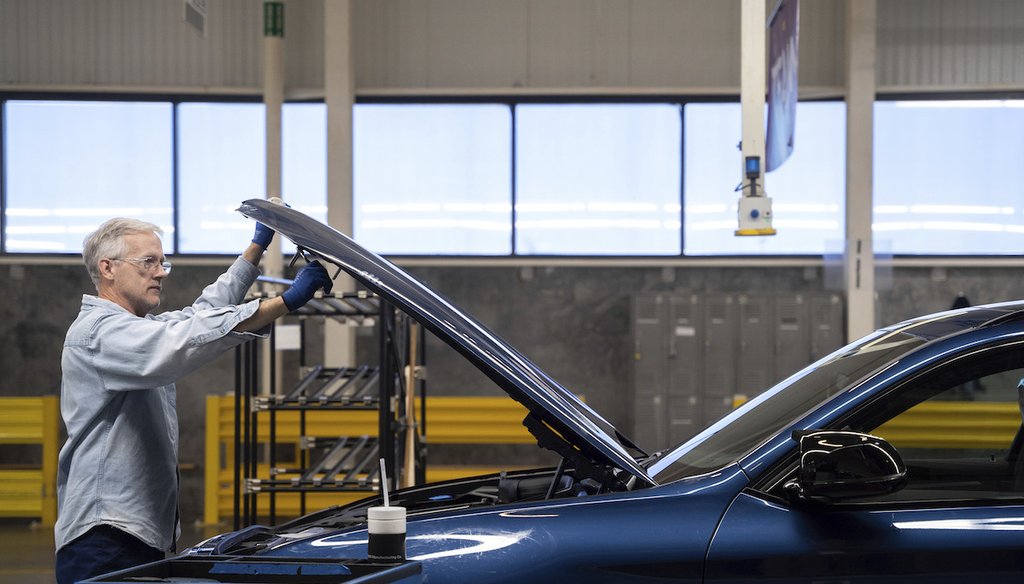 A worker checks a new vehicle at a BMW plant in Greer, S.C., on Oct, 19, 2022. (AP)