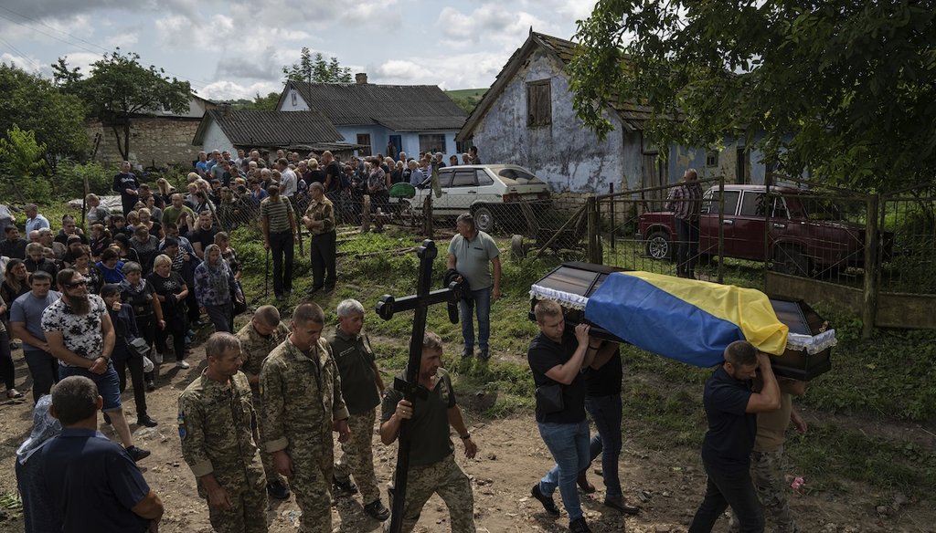 The coffin of Ukrainian serviceman Bohdan Kobylianskyi, who was killed in Ukraine's Donbas region, is carried during a funeral ceremony in Dusaniv, Ukraine, on July 22, 2023. (AP)