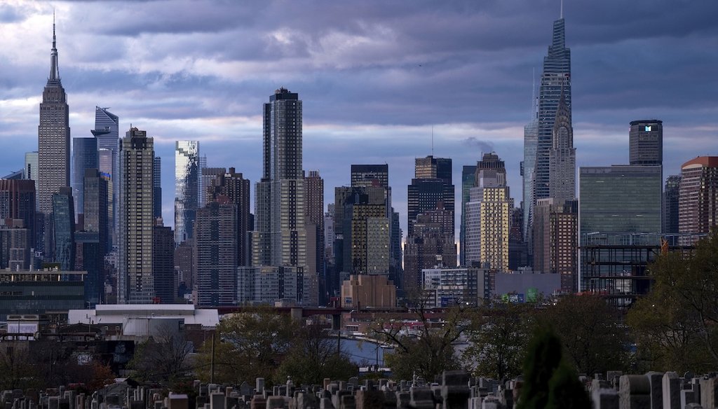 The sun sets behind the New York City skyline on Nov. 13, 2022. (AP)