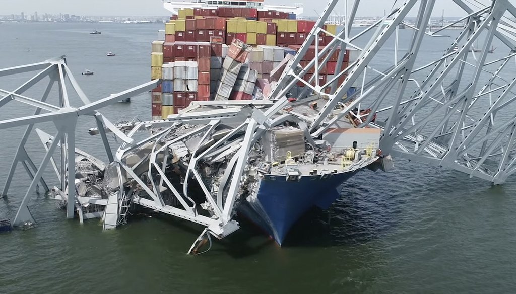 In this image taken from video released by the National Transportation and Safety Board, the cargo ship Dali is stuck under part of the structure of the Francis Scott Key Bridge after the ship hit the bridge, Tuesday, March 26, 2024, in Baltimore. (AP)