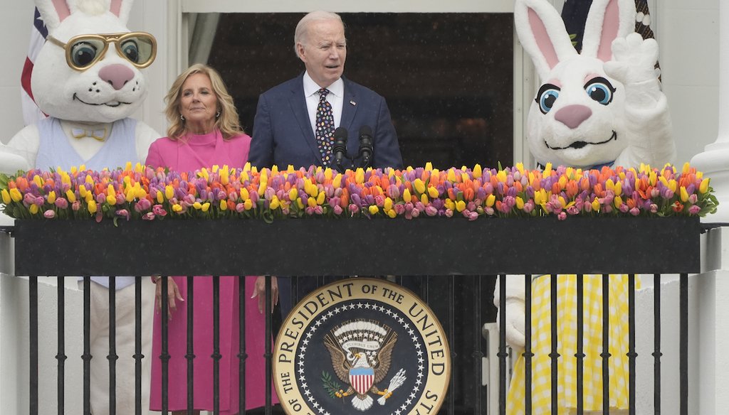 President Joe Biden speaks, with first lady Jill Biden, from the Blue Room Balcony toward The White House Easter Egg Roll on the South Lawn of the White House in Washington, Monday, April 1, 2024. (AP)