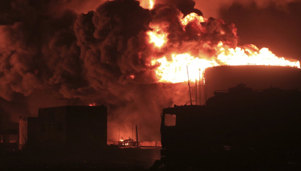 FILE - Oil tanks burn at the port in Hodeidah, Yemen, Saturday, July 20, 2024. The Israeli army said it struck several Houthi targets in western Yemen following the rebel group's fatal drone attack in Tel Aviv the previous day. (AP)