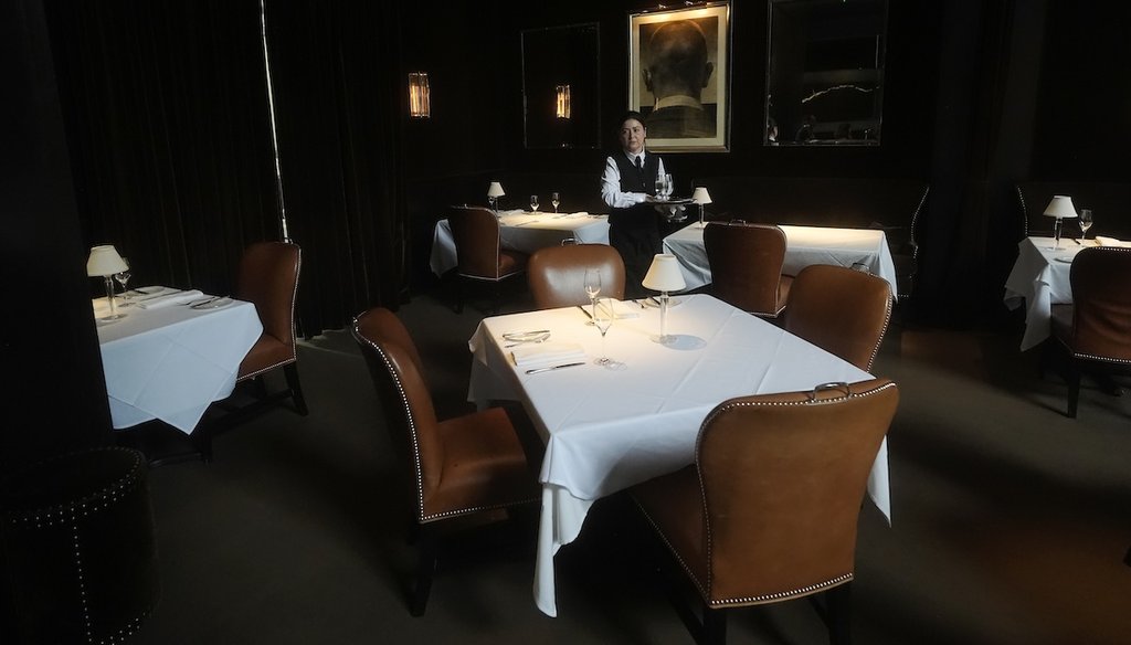 Camilla Souza clears a table after customers dined at Spruce restaurant in San Francisco on Aug. 29, 2024. (AP)