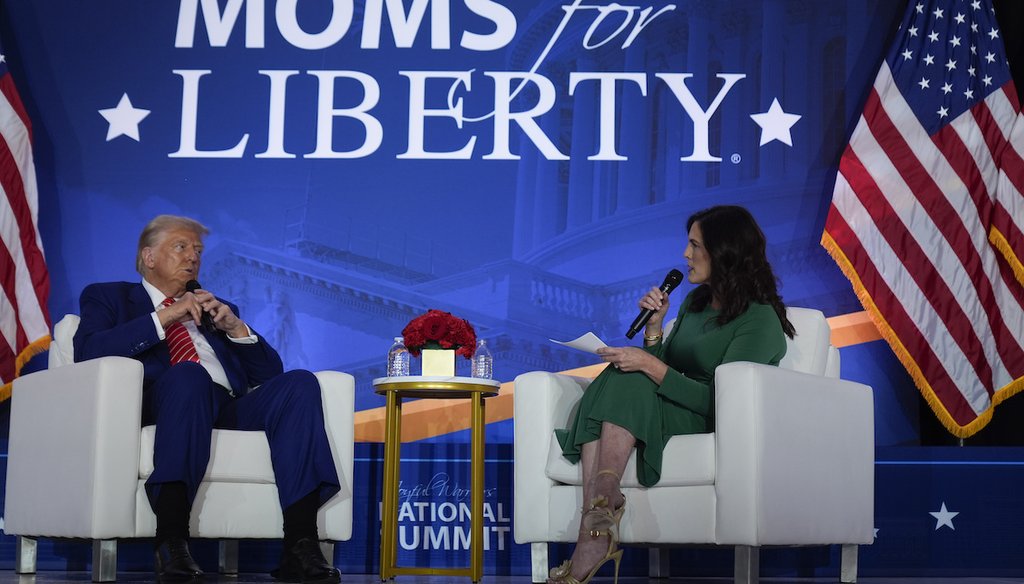 Republican presidential nominee former President Donald Trump speaks with Moms for Liberty co-founder Tiffany Justice during an event at the group's annual convention in Washington, Aug. 30, 2024. (AP)