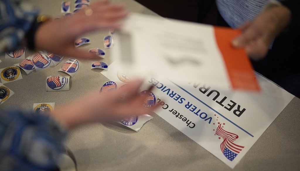 A voter returns a mail-in ballot Oct. 25, 2024, at a Voter Services satellite office at the Chester County Government Services Center in West Chester, Pa. (AP)