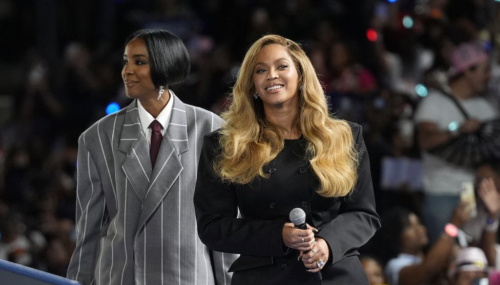 Musical artists Beyonce, right, and Kelly Rowland, left, on stage at a campaign event for Democratic presidential nominee Vice President Kamala Harris in Houston, Friday, Oct. 25, 2024. (AP)