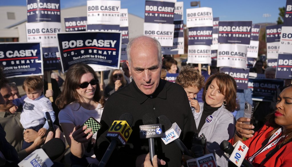 Sen. Bob Casey, D-Pa., left, stops to speak to members of the media before voting, Nov. 5, 2024, in Scranton, Pa. (AP)