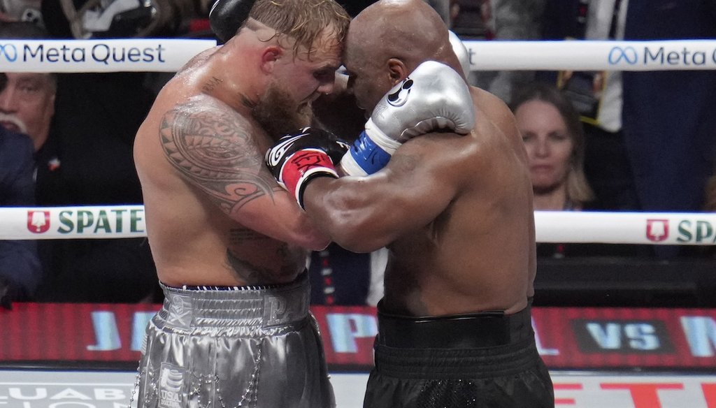 Jake Paul and Mike Tyson embrace after their heavyweight boxing match, Friday, Nov. 15, 2024, in Arlington, Texas. (AP)