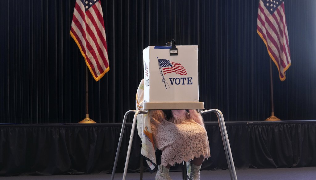 A voter works on her ballot at a polling place at the Ronald Reagan Presidential Library on Election Day, Tuesday, Nov. 5, 2024, in Simi Valley, Calif. (AP