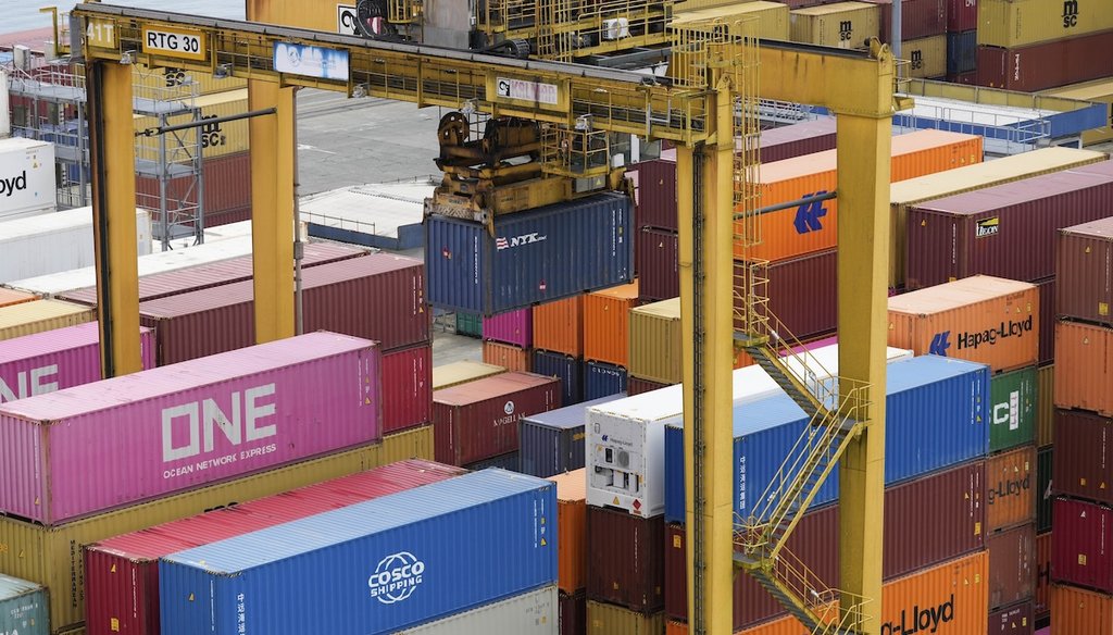 Cranes unload containers from a cargo ship at the seaport in Buenaventura on Colombia's Pacific coast on April 9, 2025. (AP)