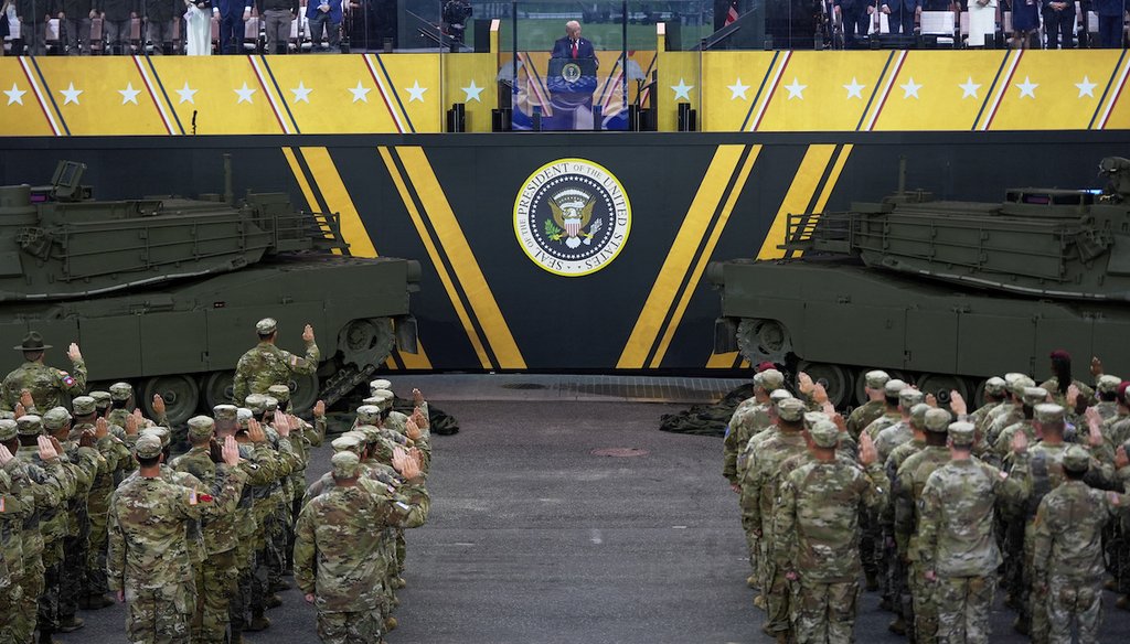 President Donald Trump participates in a reenlistment ceremony for Army soldiers during a military parade commemorating the Army's 250th anniversary June 14, 2025, in Washington. (AP)