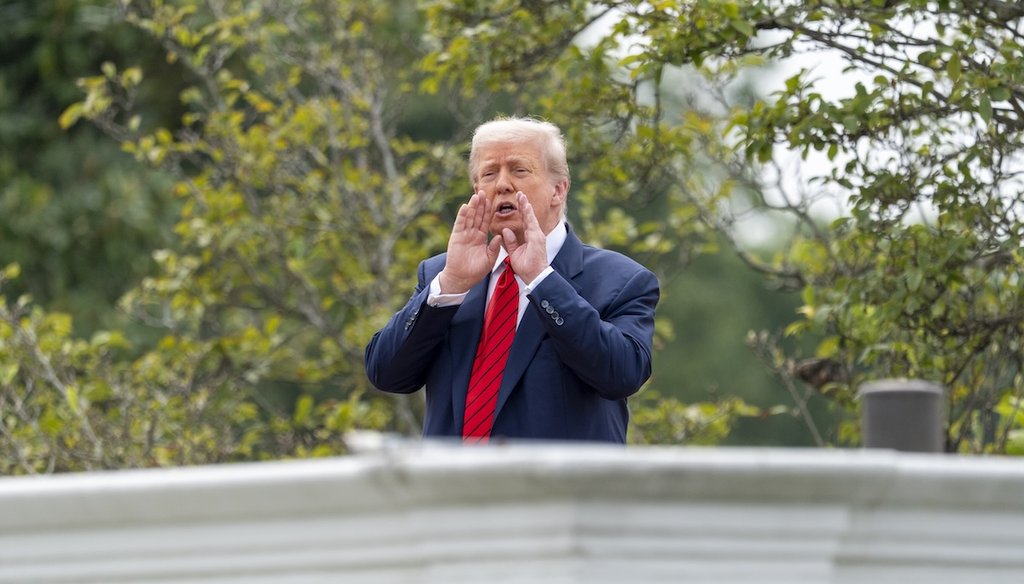President Donald Trump shouts to reporters as he surveys the grounds of the White House on Aug. 5, 2025. (AP)
