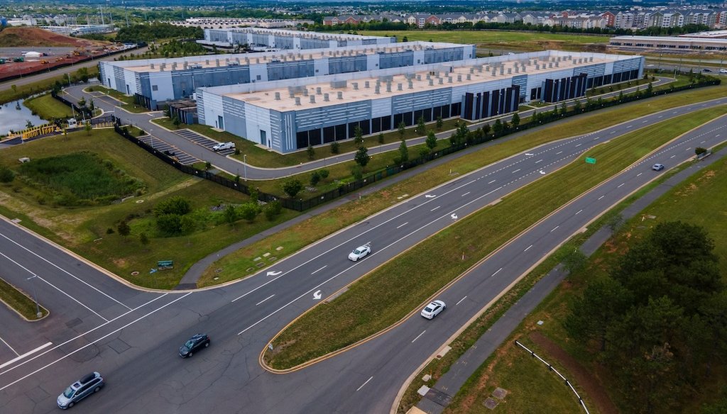 Cars drive past data centers that house computer servers and hardware required to support modern internet use, such as artificial intelligence, in Ashburn, Virginia, July 16, 2023. (AP)