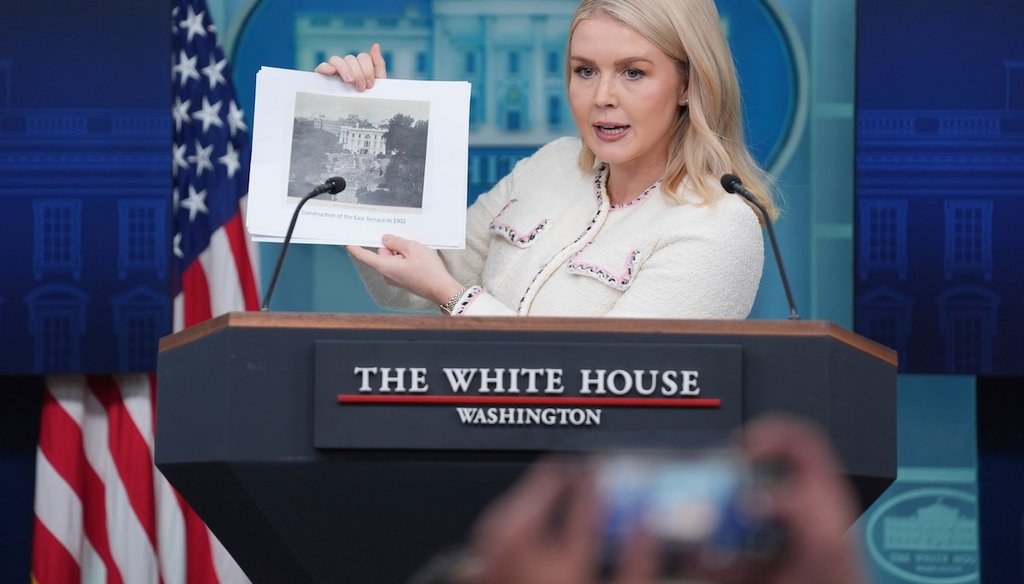 White House press secretary Karoline Leavitt holds up a historic photo showing construction of the East Terrace of the White House in 1902 during a White House press briefing on Oct. 23, 2025. (AP)