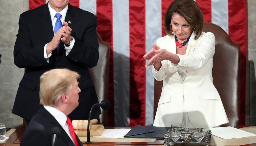 President Donald Trump turns to House Speaker Nancy Pelosi at his State of the Union address as Vice President Mike Pence watches, Feb. 5, 2019. (AP)