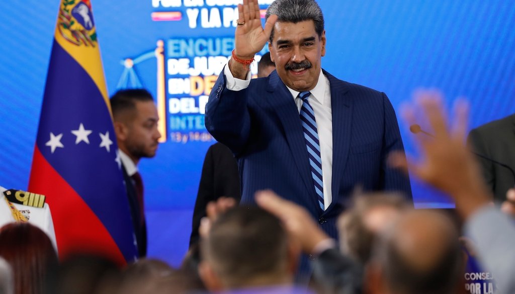 Venezuela's President Nicolas Maduro waves at the end of a conference on international law in Caracas, Venezuela, Nov. 14, 2025. (AP)
