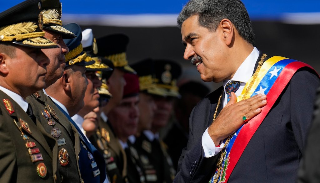Venezuela's President Nicolás Maduro places his hand over his heart while talking to high-ranking officers during a military ceremony on his inauguration day for a third term, in Caracas, Venezuela, Jan. 10, 2025. (AP)