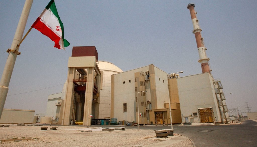 An Iranian flag flutters near the reactor building of the Bushehr nuclear power plant in Bushehr, Iran, in 2010. (AP)