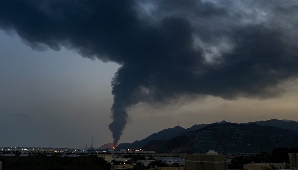 A large fire and a plume of smoke is visible after debris of an Iranian intercepted drone hit the Fujairah oil facility in the United Arab Emirates on March 3, 2026. (AP)
