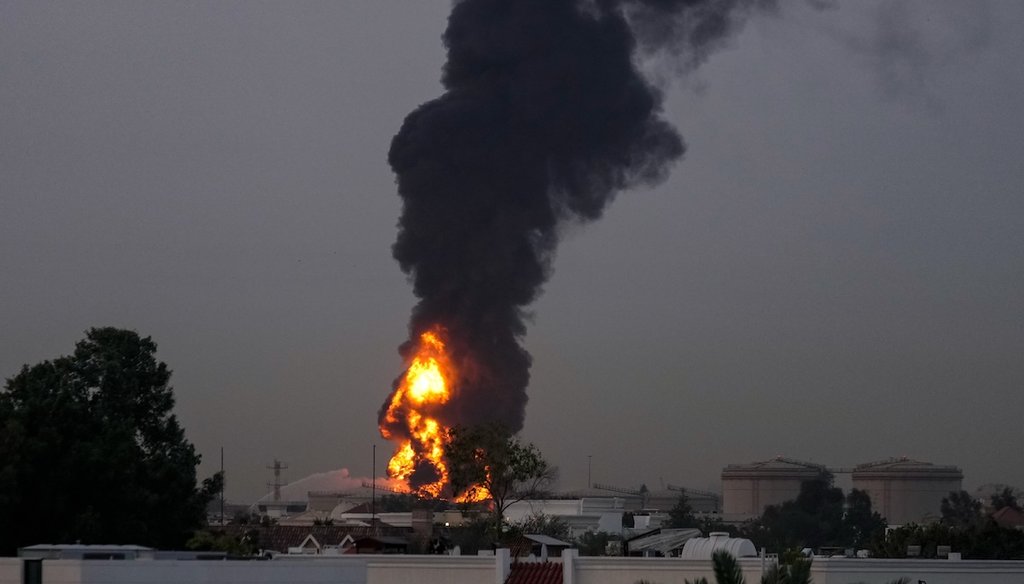Smoke rises after s drone struck a fuel tank near Dubai International Airport in the United Arab Emirates, forcing the temporary suspension of flights, on March 16, 2026. (AP)