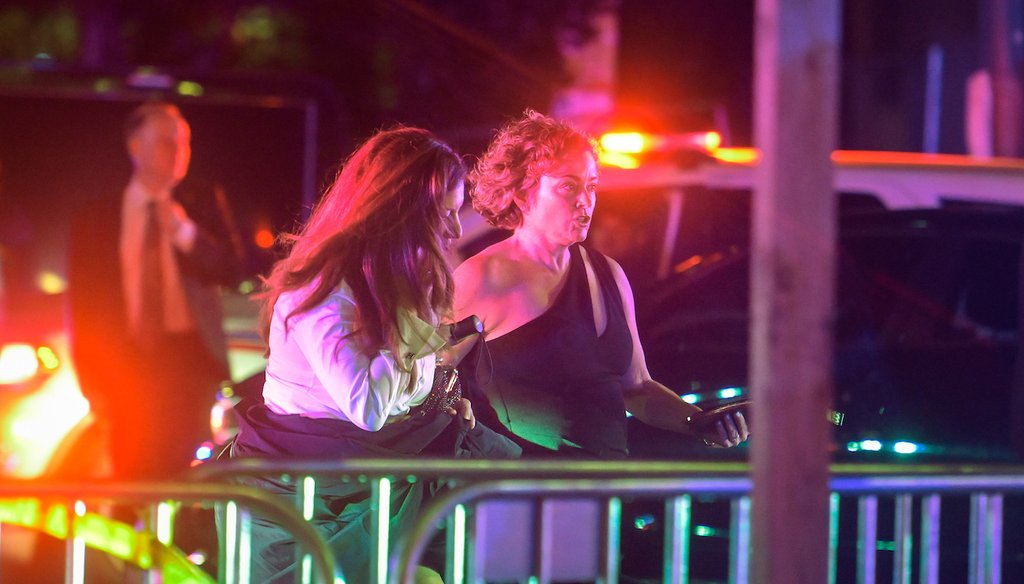 Guests of the White House Correspondents' dinner are escorted away from the scene as members of the U.S. Secret Service and local police work to contain the chaos outside the Washington Hilton following a shooting inside, April 25, 2026. (AP)