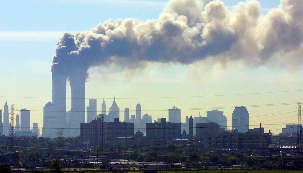 As seen from the New Jersey Turnpike near Kearny, N.J., smoke billows from the twin towers of the World Trade Center in New York after airplanes crashed into both towers on Sept.11, 2001. (AP/Boyars)
