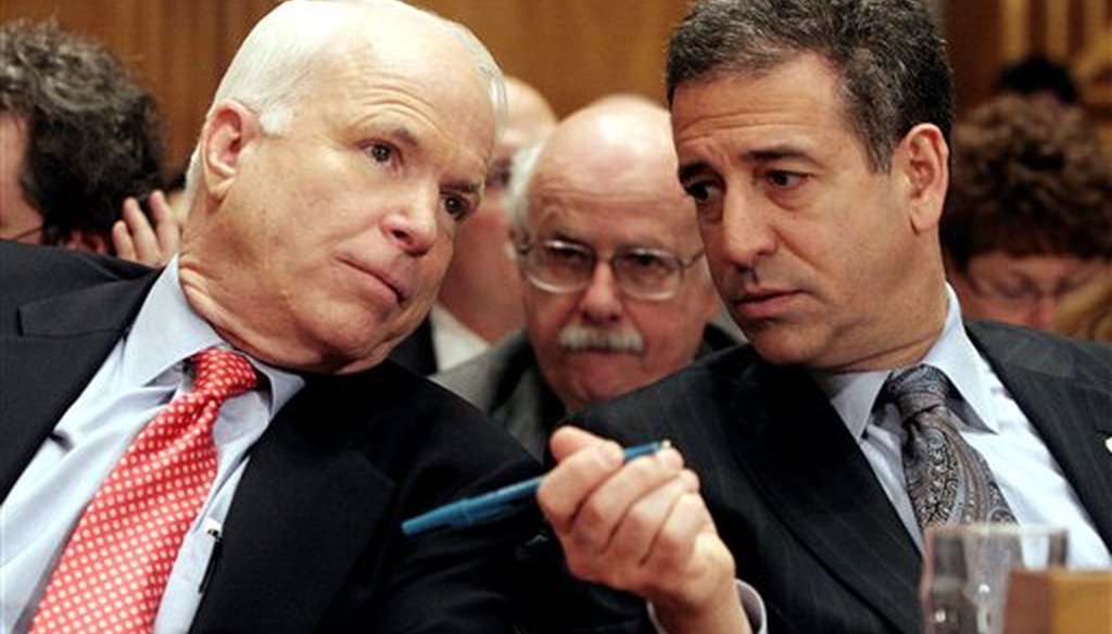 In this Jan. 25, 2006 file photo, Sen. John McCain, R-Ariz., left, chats with Sen. Russ Feingold, D-Wis. on Capitol Hill in Washington. (AP Photo/Lauren Victoria Burke, File)