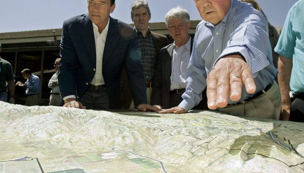 Bob Stine, right, CEO of the Tejon Ranch Co., examines a mockup of a vast nature preserve with then-California Gov. Arnold Schwarzenegger on May 8, 2008, in Lebec, Calif., north of Los Angeles. AP Photo/Ric Francis