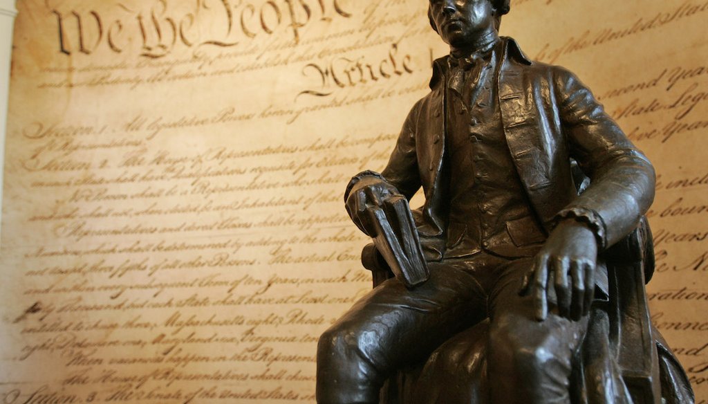 A statue of former President James Madison is shown in front of a mural of the Constitution in the education center at Montpelier, Madison's home, in Orange, Va., on Aug. 13, 2008. (AP)