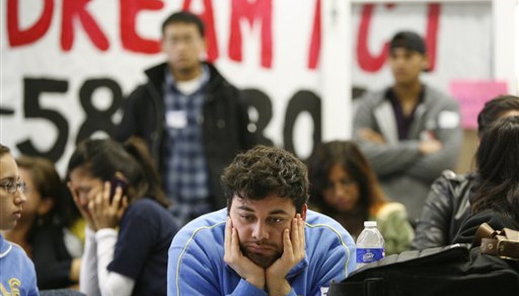 In this 2010 file photo, UCLA student Jose Ortiz, 20, reacts as the Dream Act fails to move forward in the Senate during televised coverage of proceedings at the UCLA Downtown Labor Center in Los Angeles, Dec. 18, 2010. (AP/Jason Redmond)