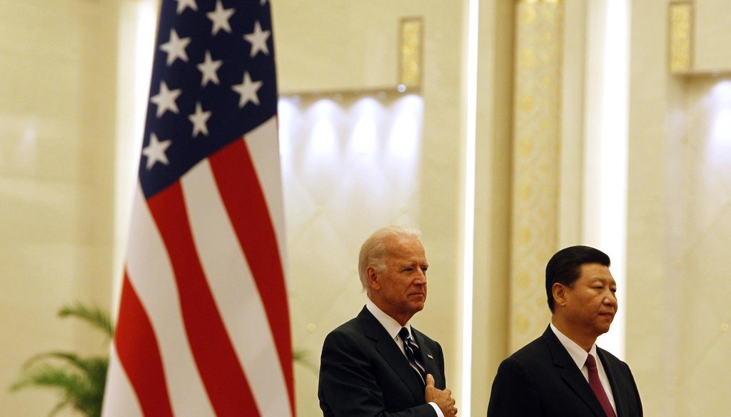 Joe Biden with Xi Jinping at the Great Hall of the People in Beijing. (AP)