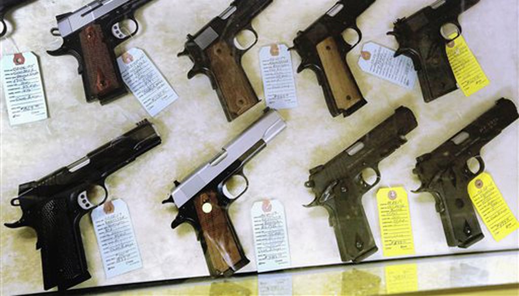Semi-automatic handguns are seen displayed for purchase. (AP)