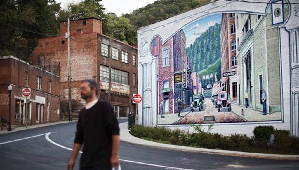 A mural depicting a more vibrant time in the town's history decorates a building in Welch, W.Va. (AP/David Goldman)