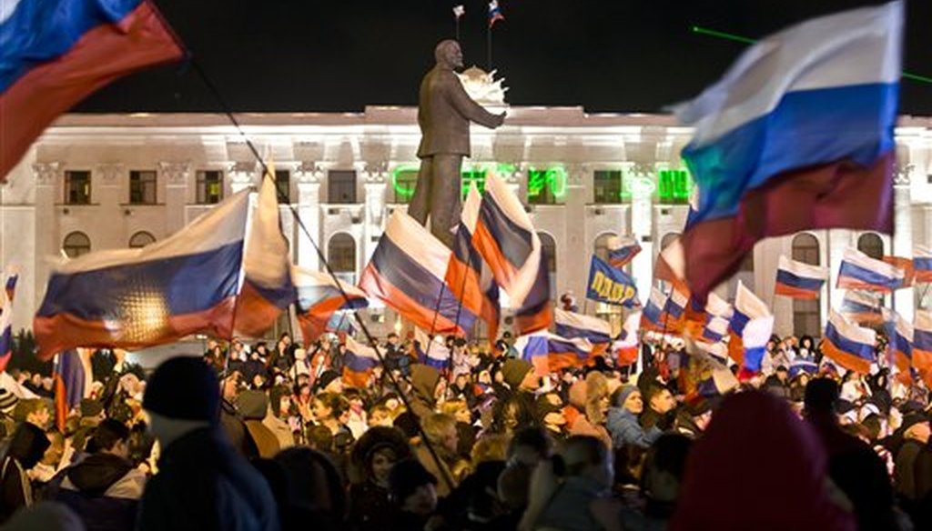 A pro-Russian crowd celebrates a referendum on seceding from Ukraine and seeking annexation by Russia, in Lenin Square in Simferopol, Crimea, on March 16, 2014. (AP/Vadim Ghirda)
